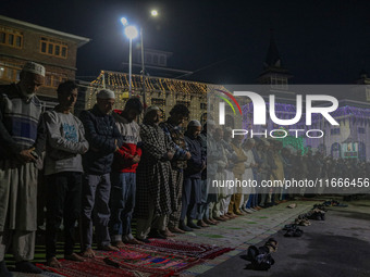 Kashmiri Muslims offer prayers at the shrine of Sheikh Abdul Qadir Jeelani, a Sufi saint, on his death anniversary outside his shrine in Sri...