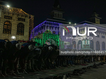 Kashmiri Muslims offer prayers at the shrine of Sheikh Abdul Qadir Jeelani, a Sufi saint, on his death anniversary outside his shrine in Sri...