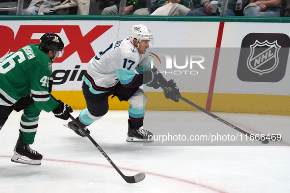 Jaden Schwartz #17 of the Seattle Kraken skates on the ice while controlling the puck during the NHL match between the Dallas Stars and the...