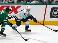 Jaden Schwartz #17 of the Seattle Kraken skates on the ice while controlling the puck during the NHL match between the Dallas Stars and the...