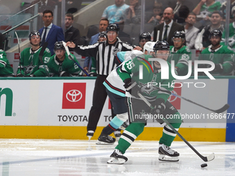 Matt Duchene #95 of the Dallas Stars skates on the ice with the puck during the NHL match between the Dallas Stars and the Seattle Kraken at...