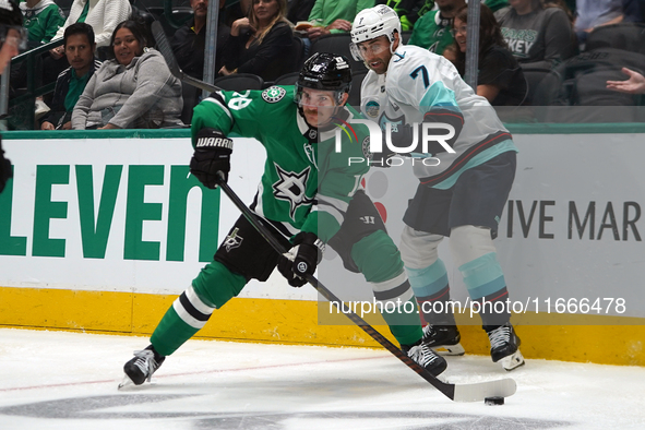 Sam Steel #18 of the Dallas Stars skates on the ice with the puck during the NHL match between the Dallas Stars and the Seattle Kraken at Am...