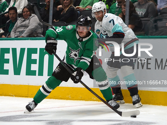 Sam Steel #18 of the Dallas Stars skates on the ice with the puck during the NHL match between the Dallas Stars and the Seattle Kraken at Am...