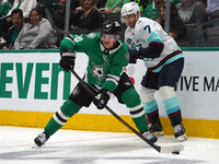 Sam Steel #18 of the Dallas Stars skates on the ice with the puck during the NHL match between the Dallas Stars and the Seattle Kraken at Am...