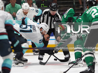 Tyler Seguin #91 of the Dallas Stars and Shane Wright #51 of the Seattle Kraken line up against one another during the NHL match between the...