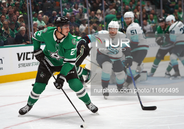 Mason Marchment #27 of the Dallas Stars skates on the ice with the puck during the NHL match between the Dallas Stars and the Seattle Kraken...