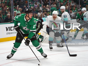 Mason Marchment #27 of the Dallas Stars skates on the ice with the puck during the NHL match between the Dallas Stars and the Seattle Kraken...