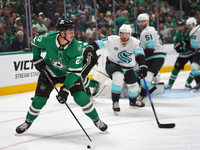 Mason Marchment #27 of the Dallas Stars skates on the ice with the puck during the NHL match between the Dallas Stars and the Seattle Kraken...