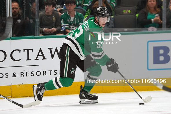 Wyatt Johnston #53 of the Dallas Stars skates on the ice with the puck during the NHL match between the Dallas Stars and the Seattle Kraken...