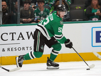 Wyatt Johnston #53 of the Dallas Stars skates on the ice with the puck during the NHL match between the Dallas Stars and the Seattle Kraken...