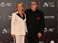 Francesca Lo Schiavo and Dante Ferretti attend the red carpet for the film Megalopolis at Cinecitta Studios in Rome, Italy, on October 14, 2...