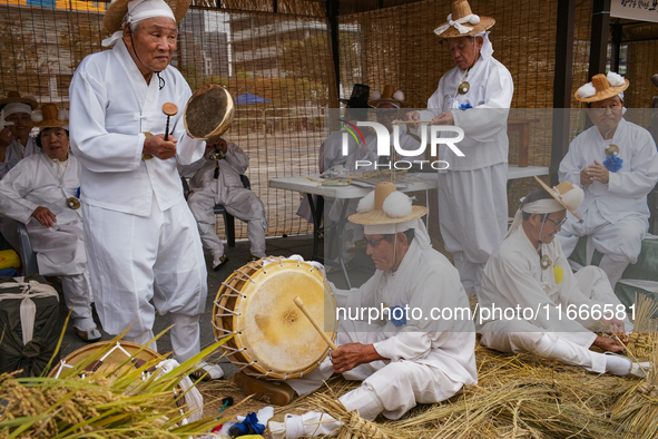 Traditional musicians take a break during the reenactment of the Dangjin Gijisi Tug-of-War, as part of the '2025-2026 Visit Chungnam Year' p...