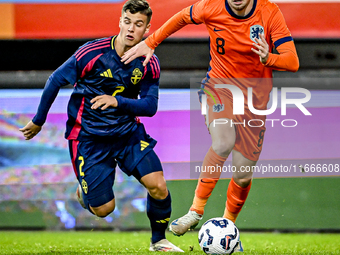 Sweden player Samuel Dahl and Netherlands player Kenneth Taylor participate in the match between Netherlands U21 and Sweden U21 at the Goffe...