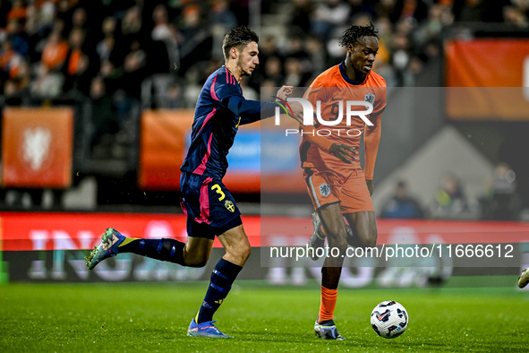 Sweden player Noah Eile and Netherlands player Emmanuel Emegha participate in the match between Netherlands U21 and Sweden U21 at the Goffer...