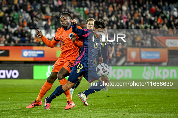 Netherlands player Noah Ohio and Sweden player Matteo Perez Vinlof participate in the match between Netherlands U21 and Sweden U21 at the Go...