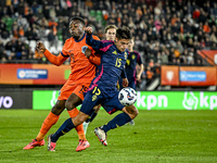 Netherlands player Noah Ohio and Sweden player Matteo Perez Vinlof participate in the match between Netherlands U21 and Sweden U21 at the Go...