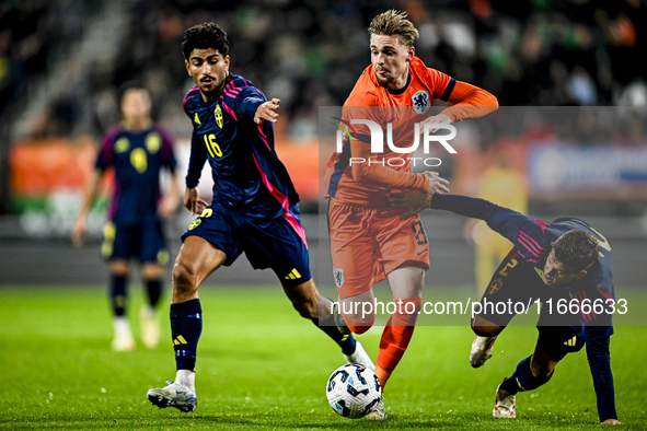 Sweden player Ahmed Qasem, Netherlands player Kenneth Taylor, and Sweden player Samuel Dahl are present during the match between Netherlands...