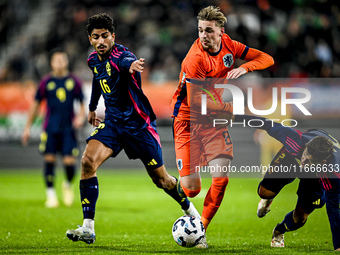 Sweden player Ahmed Qasem, Netherlands player Kenneth Taylor, and Sweden player Samuel Dahl are present during the match between Netherlands...