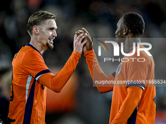 Netherlands player Kenneth Taylor and Netherlands player Neraysho Kasanwirjo celebrate a goal during the match between Netherlands U21 and S...