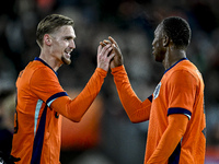 Netherlands player Kenneth Taylor and Netherlands player Neraysho Kasanwirjo celebrate a goal during the match between Netherlands U21 and S...