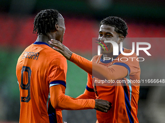 Netherlands players Emmanuel Emegha and Ryan Flamingo participate in the match between Netherlands U21 and Sweden U21 at the Goffertstadion...