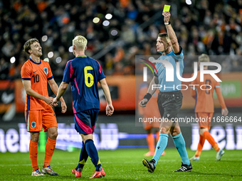 Referee Robert Jones shows a yellow card to Netherlands player Youri Regeer during the match between Netherlands U21 and Sweden U21 at the G...