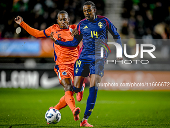 Netherlands player Ryan Flamingo and Sweden player Amar Fatah participate in the match between Netherlands U21 and Sweden U21 at the Goffert...