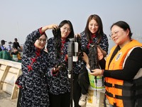 Internet anchors sell fresh laver via live streaming at sea in Lianyungang, China, on October 15, 2024. (