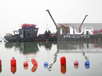 Farmers release new varieties of oyster seedlings in an oyster culture area in Lianyungang, China, on October 15, 2024. (