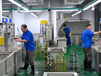 A worker electroplates metal jewelry at a jewelry processing plant in Jinhua, China, on October 15, 2024. (