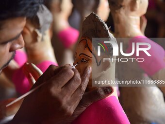 An artist paints an idol of the Hindu Goddess Laxmi at his workshop ahead of the Laxmi Puja in Nagaon District, Assam, India, on October 15,...