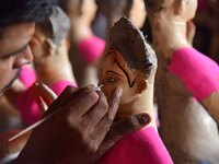 An artist paints an idol of the Hindu Goddess Laxmi at his workshop ahead of the Laxmi Puja in Nagaon District, Assam, India, on October 15,...