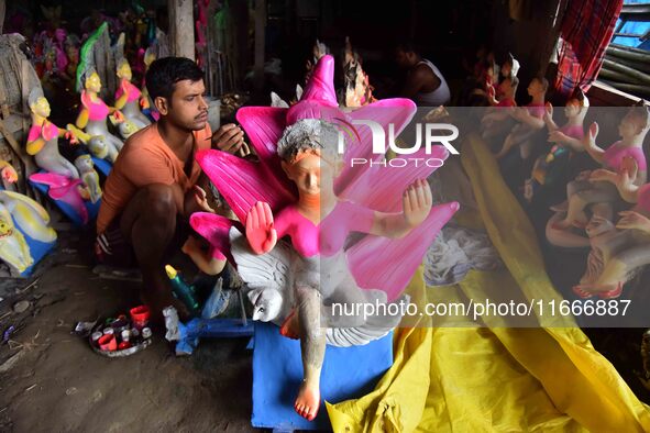 An artist paints an idol of the Hindu Goddess Laxmi at his workshop ahead of the Laxmi Puja in Nagaon District, Assam, India, on October 15,...