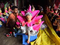 An artist paints an idol of the Hindu Goddess Laxmi at his workshop ahead of the Laxmi Puja in Nagaon District, Assam, India, on October 15,...