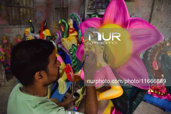 An artist paints an idol of the Hindu Goddess Laxmi at his workshop ahead of the Laxmi Puja in Nagaon District, Assam, India, on October 15,...