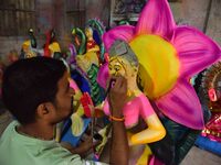 An artist paints an idol of the Hindu Goddess Laxmi at his workshop ahead of the Laxmi Puja in Nagaon District, Assam, India, on October 15,...