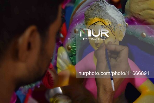 An artist paints an idol of the Hindu Goddess Laxmi at his workshop ahead of the Laxmi Puja in Nagaon District, Assam, India, on October 15,...