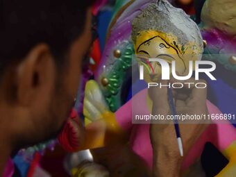 An artist paints an idol of the Hindu Goddess Laxmi at his workshop ahead of the Laxmi Puja in Nagaon District, Assam, India, on October 15,...