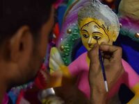 An artist paints an idol of the Hindu Goddess Laxmi at his workshop ahead of the Laxmi Puja in Nagaon District, Assam, India, on October 15,...