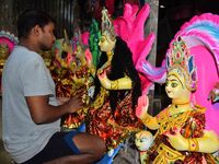 An artist prepares an idol of the Hindu Goddess Laxmi at his workshop ahead of the Laxmi Puja in Nagaon District, Assam, India, on October 1...