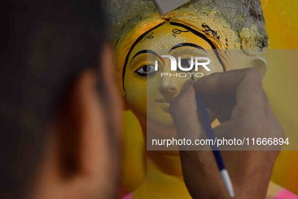 An artist paints an idol of the Hindu Goddess Laxmi at his workshop ahead of the Laxmi Puja in Nagaon District, Assam, India, on October 15,...