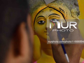 An artist paints an idol of the Hindu Goddess Laxmi at his workshop ahead of the Laxmi Puja in Nagaon District, Assam, India, on October 15,...