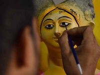 An artist paints an idol of the Hindu Goddess Laxmi at his workshop ahead of the Laxmi Puja in Nagaon District, Assam, India, on October 15,...