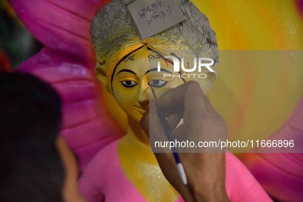 An artist paints an idol of the Hindu Goddess Laxmi at his workshop ahead of the Laxmi Puja in Nagaon District, Assam, India, on October 15,...