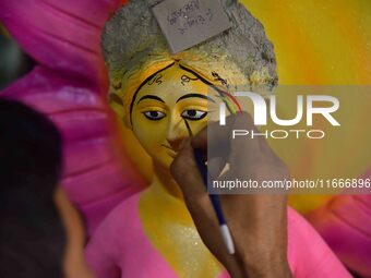 An artist paints an idol of the Hindu Goddess Laxmi at his workshop ahead of the Laxmi Puja in Nagaon District, Assam, India, on October 15,...