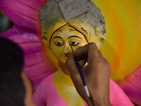 An artist paints an idol of the Hindu Goddess Laxmi at his workshop ahead of the Laxmi Puja in Nagaon District, Assam, India, on October 15,...