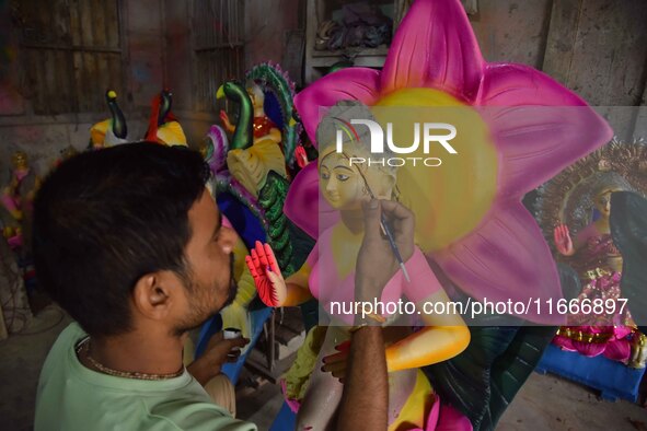 An artist paints an idol of the Hindu Goddess Laxmi at his workshop ahead of the Laxmi Puja in Nagaon District, Assam, India, on October 15,...