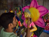 An artist paints an idol of the Hindu Goddess Laxmi at his workshop ahead of the Laxmi Puja in Nagaon District, Assam, India, on October 15,...