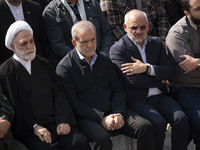 Iranian President Masoud Pezeshkian (second from left) attends a funeral ceremony for General Abbas Nilforoushan, a commander of the IRGC's...