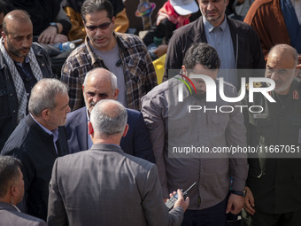 Iranian President Masoud Pezeshkian speaks with Hossein Salami, commander-in-chief of the Islamic Revolutionary Guard Corps (IRGC), after at...